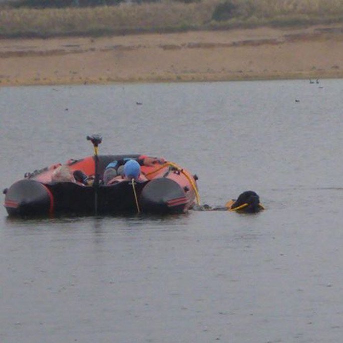 Jersey Big Dog Club with a Northern Diver 4.2m Inflatable Boat with an Aluminium Floor - being towed by a Leonberger